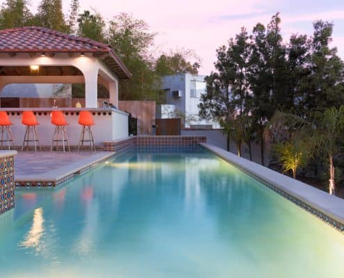 Swimming Pool and Spa at Dusk with Lights