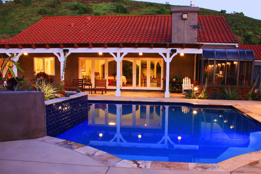 Mediterranean tiled roof next to pool