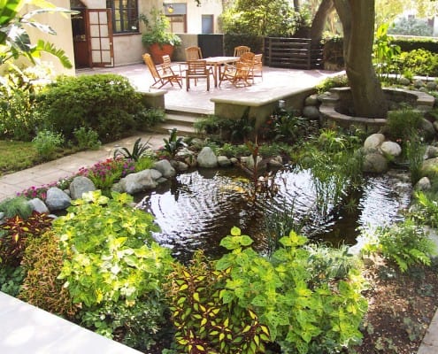 Pond next to paving stone dining area