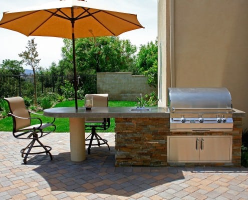 Prefab outdoor kitchen with shaded dining area