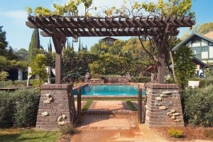 English Rustic Wood Garden By Pool with Sprinkler