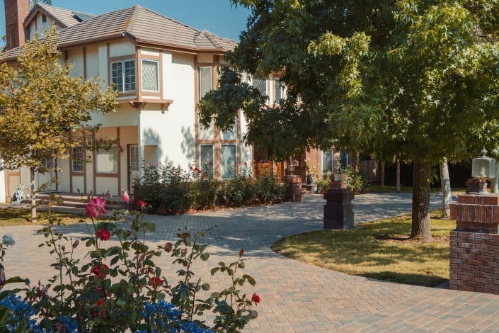 Paving Stone Driveway with Classic Lights with Flower Decorations