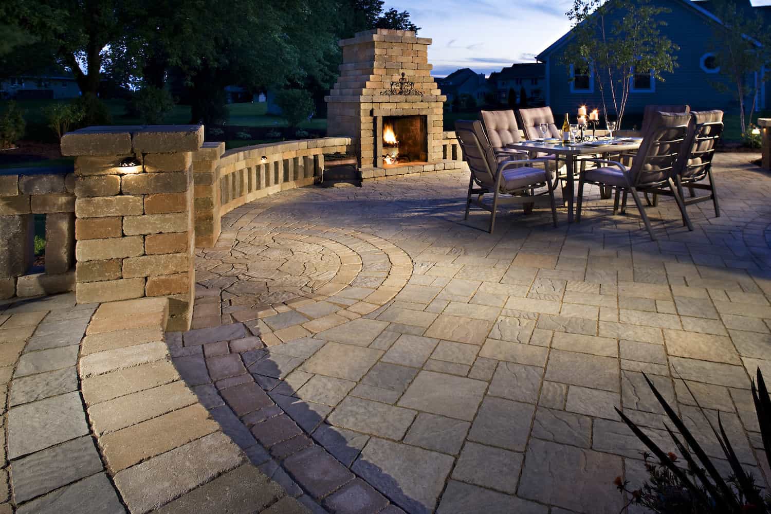 Paving Stone Fire Place on Large Paving Stone Surface with Table and Chairs