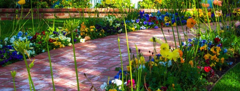 Red Masonry Walkway with Flowers