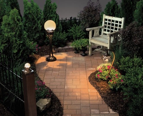 Paving stone lighting with chair and decorative plants