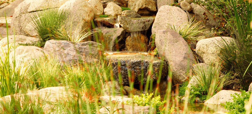 Natural rock waterfall and pond