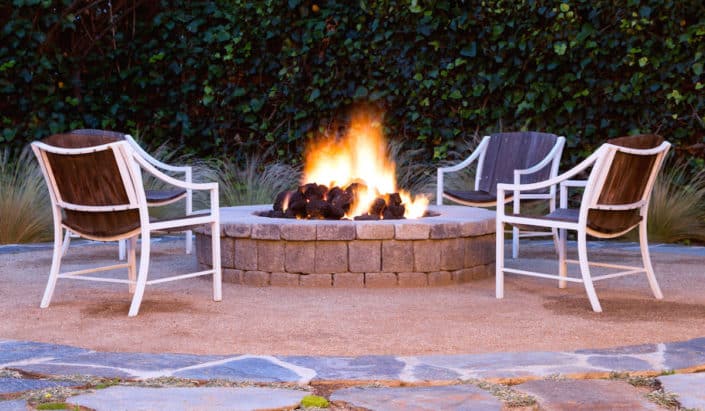 fire pit with wooden chairs outdoor design