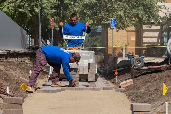 men building pavement