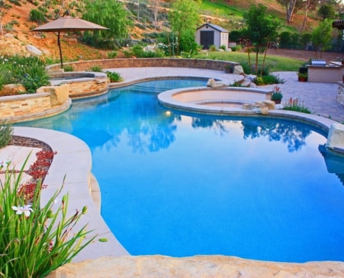 curve pool with paving stone design