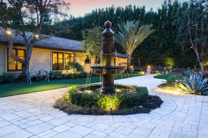 english garden fountain with paving stone courtyard