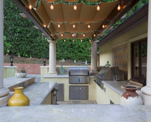 outdoor kitchen with barbecue and smoker