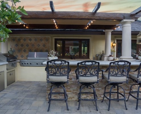 outdoor kitchen with island seating