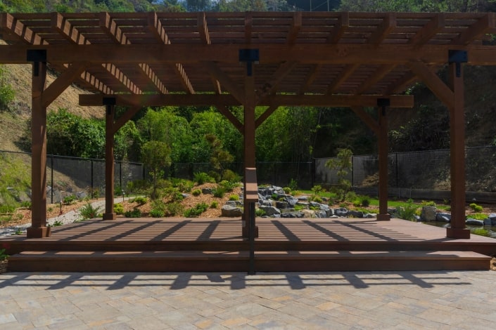 Free standing pergola with raised patio